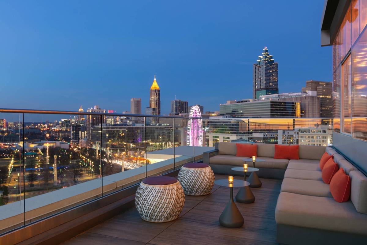 Rooftop deck at dusk with the Atlanta skyline