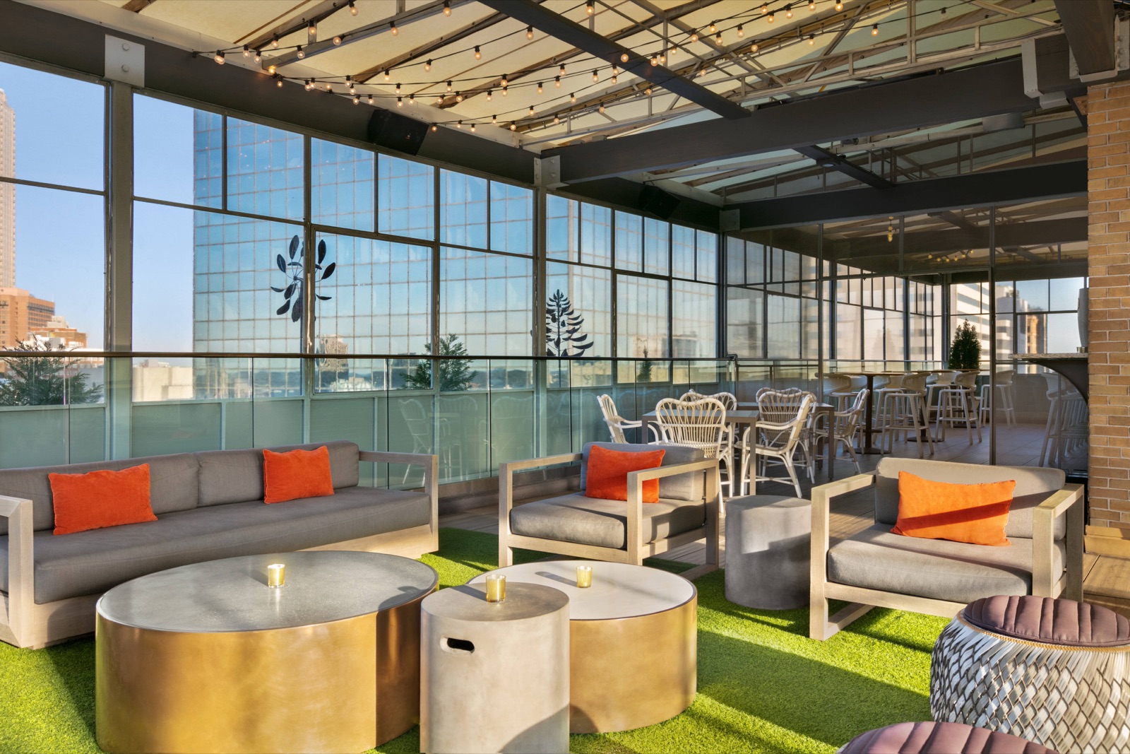 SkyLounge at Glenn: lounge seating on the rooftop terrace with city views